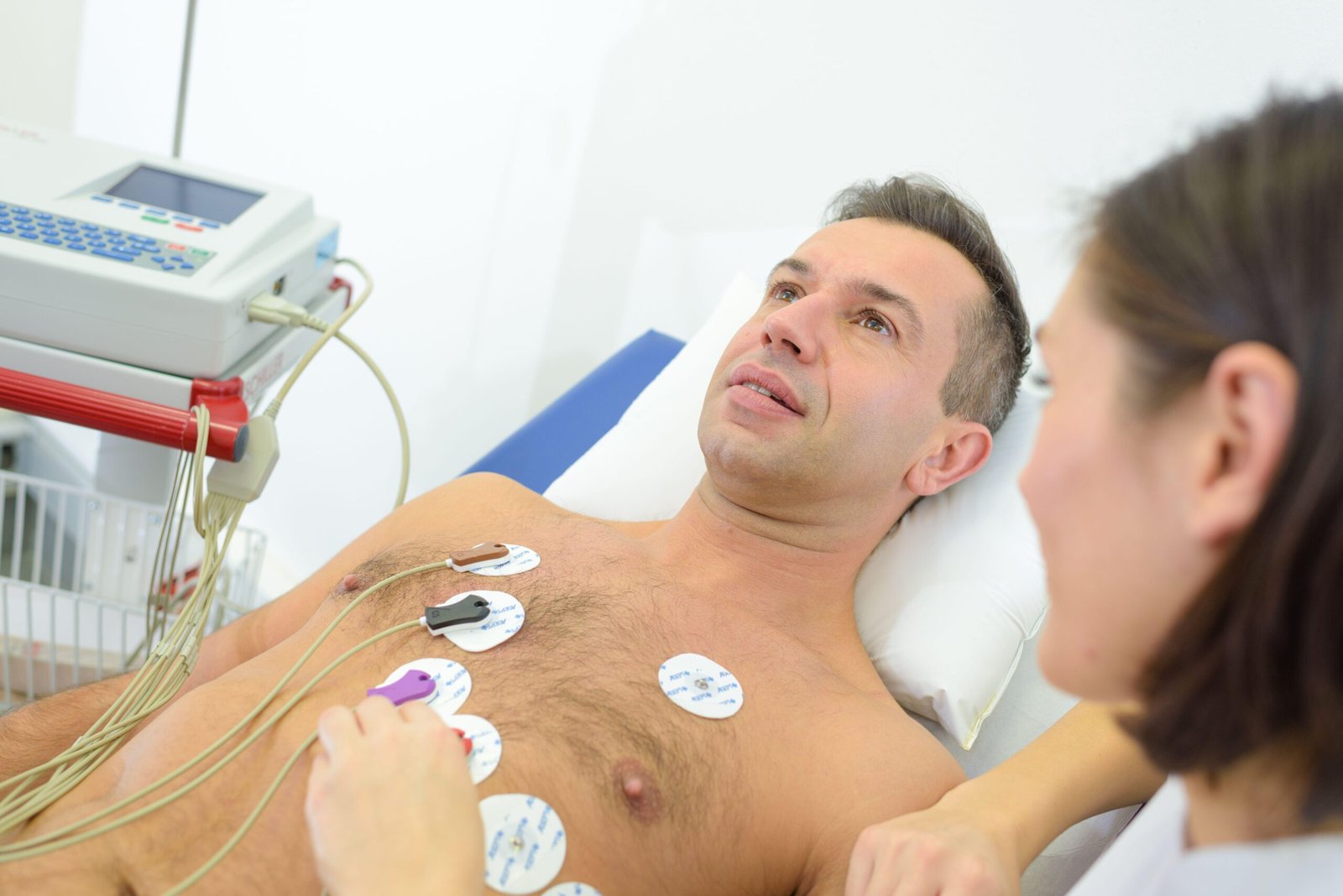 Man having heart monitor attached